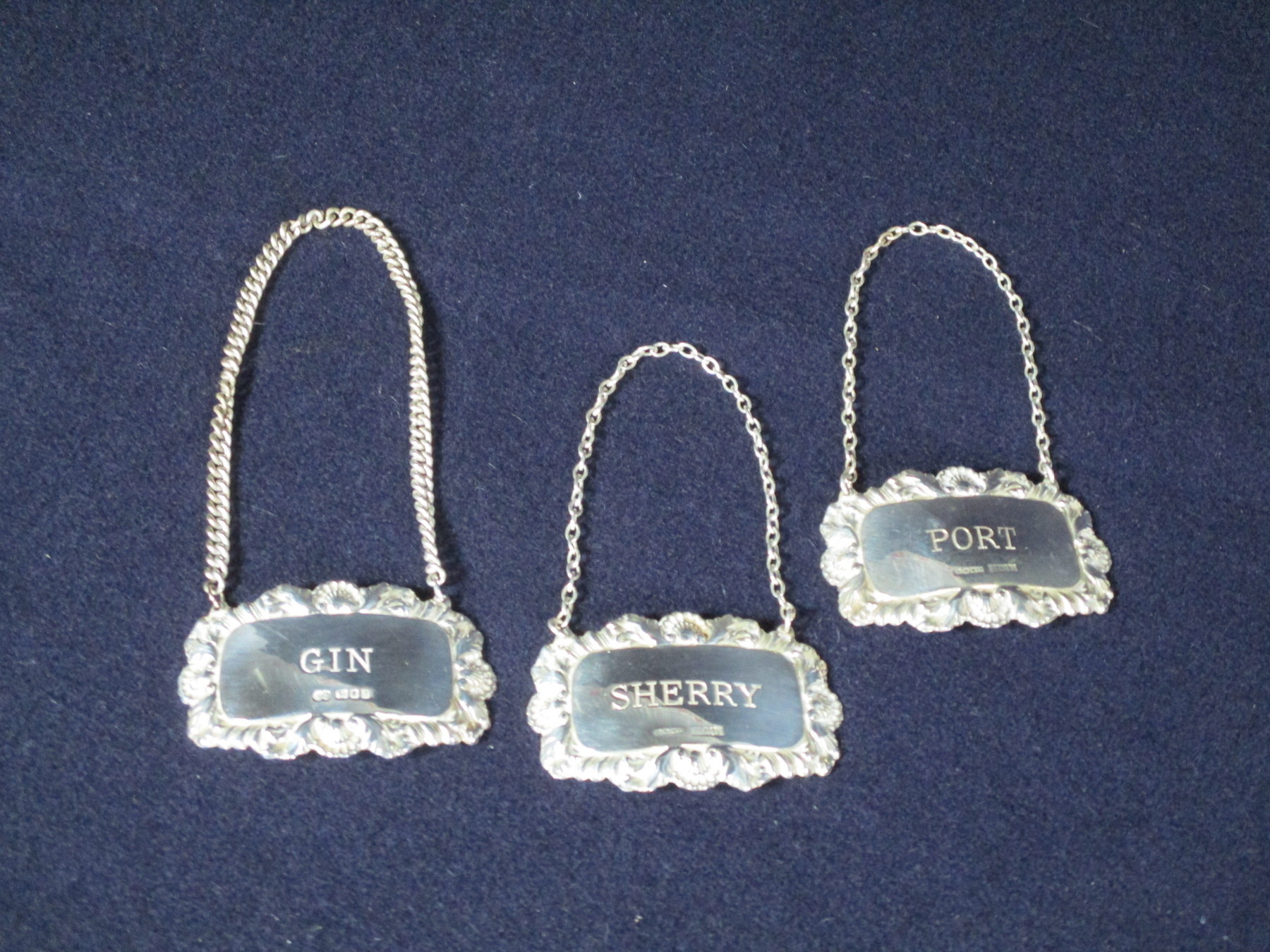 Three Silver Decanter Labels :- Gin London 1963 - N° 2 Port Birmingham 1970 - A.M. and Co Sherry