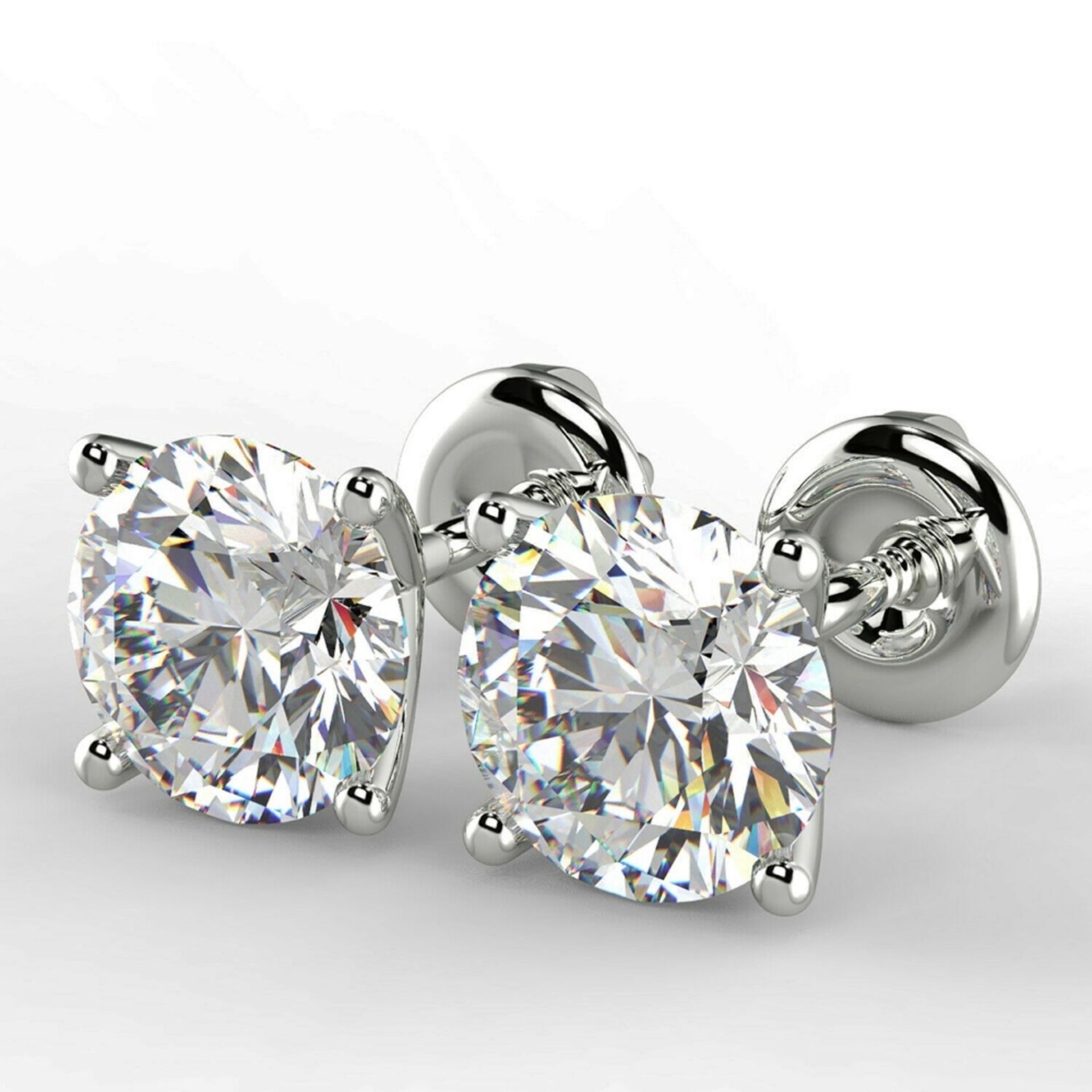 New Pair of 0.84 Carat Round Cut VS2/E Diamond Stud Earrings