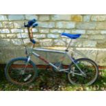 Original Raleigh Burner bicycle, with blue seat, wheels and grips