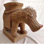 Unusual novelty wicker seat in the form of a humorous dog, 50cm high