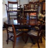 Mahogany twin pillar dining table with a set of six chairs to include two carvers (7)