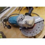 Makita 9" angle grinder, with 25+ assorted discs