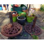 Collection of terracotta and other pots and tubs, with two cast iron umbrella stands and others