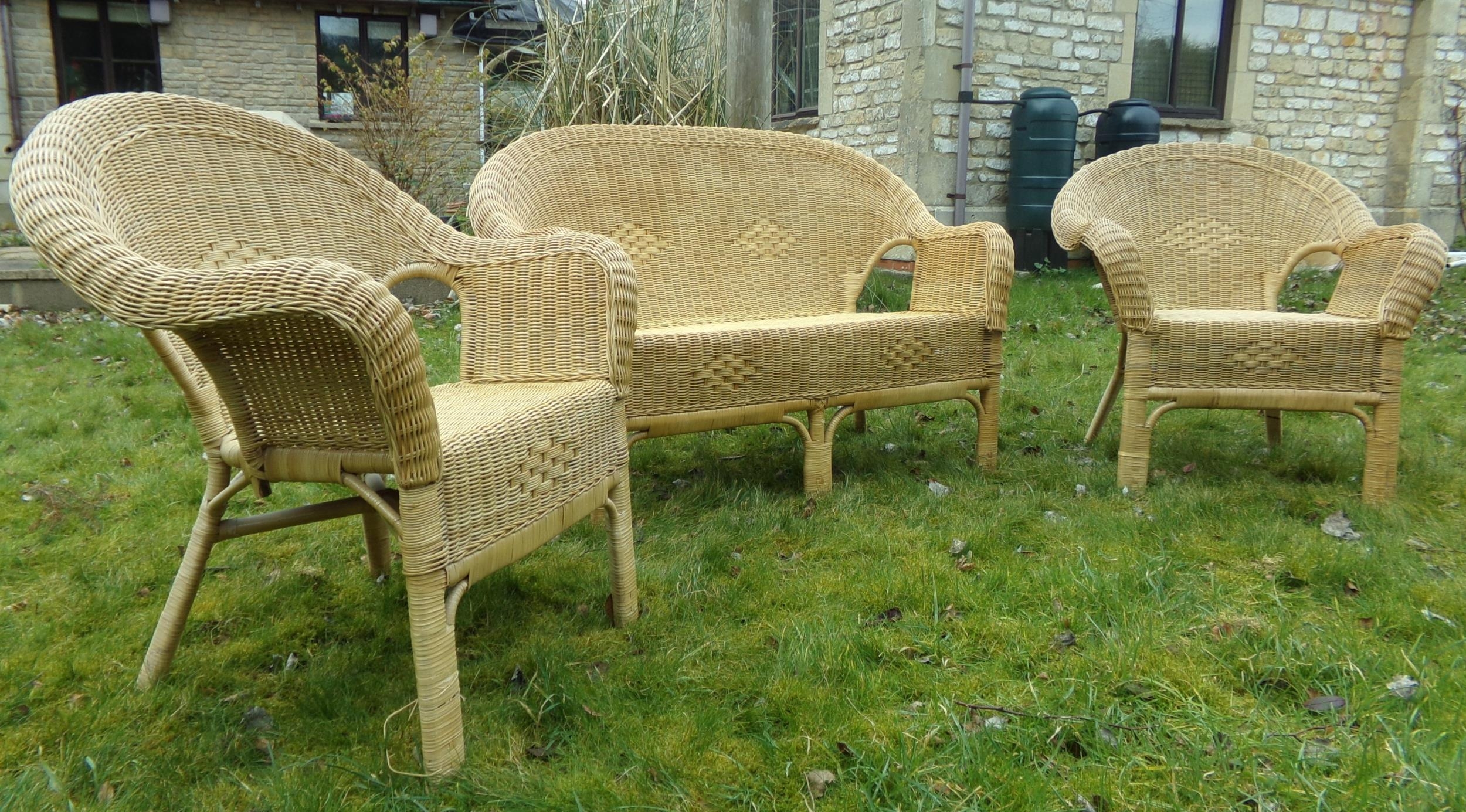 Woven cane wicker three piece conservatory suite, twin sofa and two chairs, the sofa 122cm long (3)
