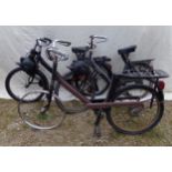 Three Velo Solex motorised push bikes in need of restoration, together with two boxes of Solex parts