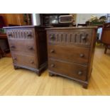 Matched pair of oak bedsides or banks of drawers, with arcaded top drawer and cup and cover knobs,