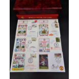 Two folders of Manchester United first day covers signed by Dennis Law, Steve Coppell etc