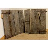 Pair of early rustic wood shutters, with iron straps, each 94 x 80 cm approx