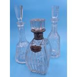 Three antique glass decanters to include a silver collared example (3)
