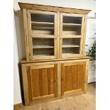 Reclaimed pine dresser / house keepers cupboard, the raised back with glazed doors on a base with