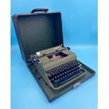 Vintage cased typewriter by Olympia