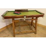 Cool vintage small scale snooker table, upon a trestle base inscribed 'Bradfords' with balls and