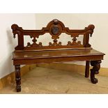 Unusual Victorian mahogany hall bench, with scrolled framework, centrally fitted with a pokerwork