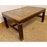 Campaign style mahogany and brass bound coffee table, the glazed top inset with a Buddhist deity, 41