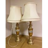 Large pair of Eastern brass table lamps with cast band decoration and shades, 88 cm high including