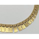A 9ct gold graduated fringe necklace stamped 375 West Germany. 21 g approx.
