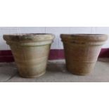 Impressive pair of large terracotta pots, with banded decoration, (one planted) 52cm high x 62cm