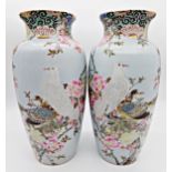 Pair of late 19th century Chinese porcelain vases, enamelled with doves amidst blossom, 38cm high