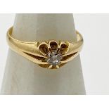 An 18ct gold gypsy ring set with a central .25 solitaire Diamond Size N 1/2, weight 3.3 g approx.