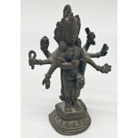 Small antique Chinese bronze figure of a standing Buddhist Deity with eight arms, possibly