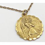 A 9ct gold St Christopher medallion with embossed decoration to both sides and diamond bright cut
