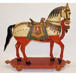 Good quality Indian folk art carved wooden horse on wheels, with hand painted decoration, 82 x 86cm