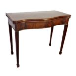 George III crossbanded flame mahogany serpentine games table, with baize lined interior and reeded