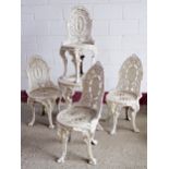 Exceptional quality cast iron terrace set in the manner of Coalbrookdale, the chairs mounted with