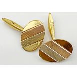A pair of 18ct gold cufflinks with tri colour gold to the front incorporating two burnished panels