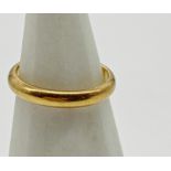 A 22ct gold wedding band, size N 1/2. Weight 4.57 g approx.