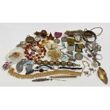An interesting mixed lot of curios and costume jewellery to include a treen bell pull and a pocket