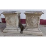 Pair of glazed pottery square plinths, flower head relief and stepped square bases, 52 x 38cm