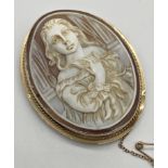 Cameo brooch depicting a classic maiden with flowing hair set into a 9ct gold mount 5 cm x 4 cm