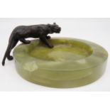 Art deco green onyx ashtray mounted by a bronze tiger, 16cm long