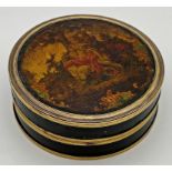 Antique tortoiseshell circular lidded box, the top lacquered with a romantic scene, 9.5cm diameter