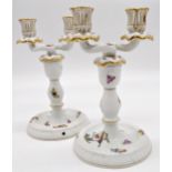 Pair of Herend of Hungary Rothschild pattern porcelain twin branch candelabra, finely painted with