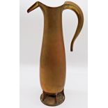 Arts and Crafts copper jug of tall organic baluster form, with segmented base and unusual flower