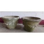 Pair of reconstituted stone planters, with swag relief decoration, 34cm high x 50cm diameter