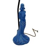 Art Deco blue glazed figural pottery lamp of a semi nude female, hands bound in chains, 52cm high