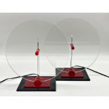 Pair of American 1980s Lucite lamps, of circular form on stepped square bases, 32cm high x 31cm wide