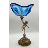 Striking Italian figural pedestal dish, Murano glass bowl held aloft by a silver plated cherub on