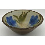 Studio pottery deep dish with flowers painted to the interior and olive green glazed rim and