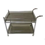 Mid-century chrome two tier drinks trolley, with gallery rail and inset smoked glass, 67cm high x