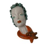 Goldscheider pottery face mask, with curled green hair and orange scarf, 29cm high