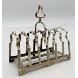 Good quality early 20th century cast silver six divisional toast rack, maker James Dixon & Sons,