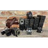 A large collection of vintage box cameras together with a further Nikon F65 camera with a 55-200mm