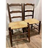 Pair of rustic French ladderback chairs with strung seats