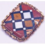 A good antique Victorian brooch set into a yellow metal mount consisting of polished and cut agate