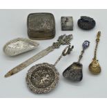 Collection of Continental and foreign silver and white metal to include strainer spoon, letter