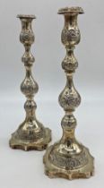 A pair of George V silver Sabbath candlesticks, with knopped stems, raised on a shaped platform